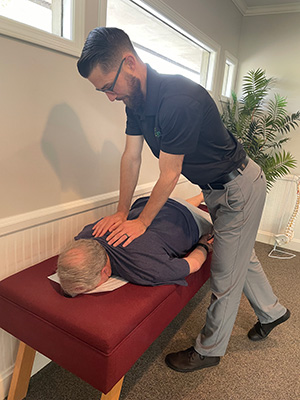 Chiropractor Greenville SC Andy Wright with Patient
