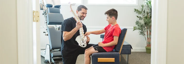 Dr. Aaron Oxenrider with a pediatric patient