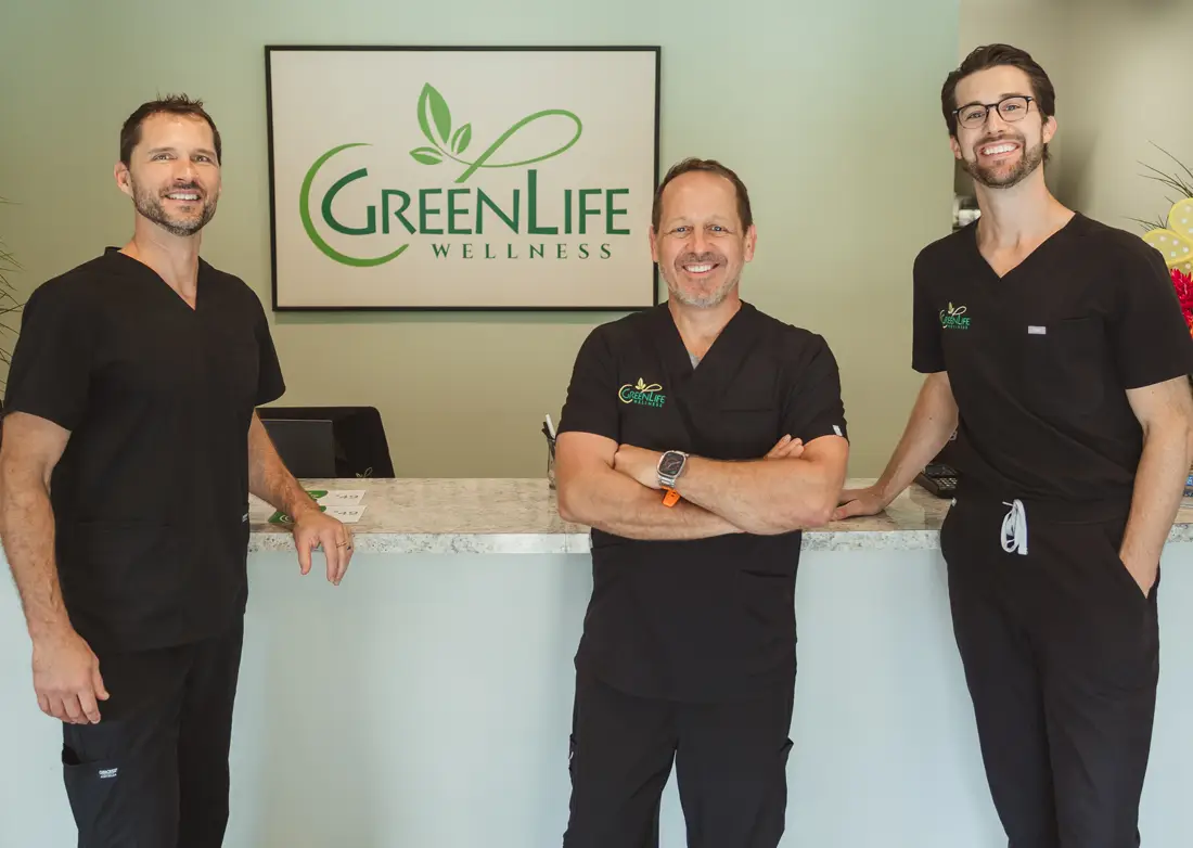Dr. Andy Wright, Dr. Bill Barnes, and Dr. Aaron Oxenrider standing at the front desk