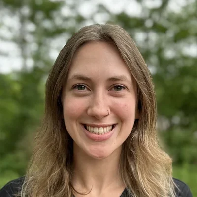 A headshot photo of Leah, a front desk employee at GreenLife Wellness