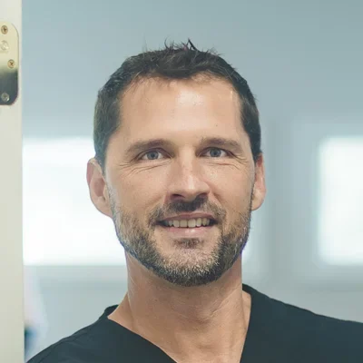 A headshot photo of Aaron Oxenrider, a chiropractor at GreenLife Wellness